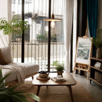 Charger l'image dans la visionneuse de galerie, Wood pendant light above a small living room table beside a window