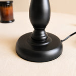 Bild in Gallery-Viewer laden, Close view of black iron lamp base and cord