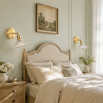 Bild in Gallery-Viewer laden, Brass and glass wall light beside a reading chair and side table