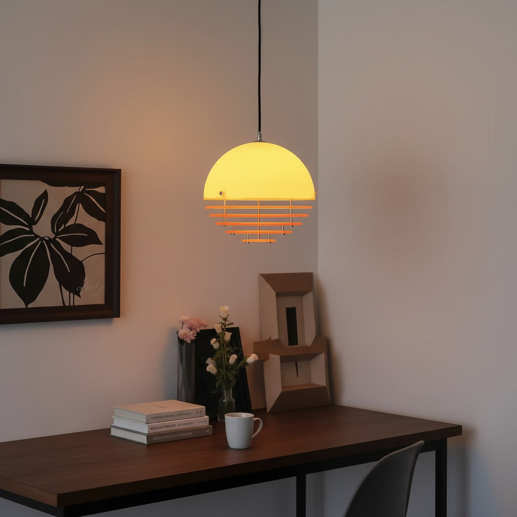 Within a minimalist space, a spherical pendant lamp illuminates as a geometric focal point, its warm glow defining the atmosphere of the entire area. This exemplifies the application of Bauhaus aesthetics in contemporary domestic interiors.