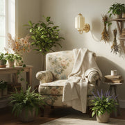 Cozy cottagecore reading nook featuring warm lighting from a vintage milk glass wall sconce.