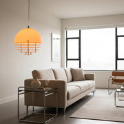 A Sunset Pendant Light hanging in a modern Bauhaus living room.