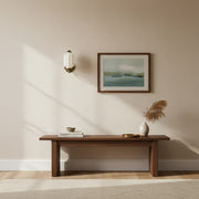 A perfectly installed cream wall sconce in a living room setting, highlighting ideal height.