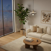 Cozy living room featuring a Fiddle Leaf Fig illuminated by a warm spectrum grow light pendant.