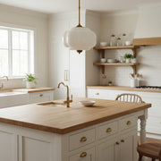 Vintage milk glass pumpkin-shaped semi flush mount pendant light in a cozy neutral-toned kitchen