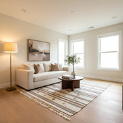 Spacious small living room interior with warm layered lighting and cozy atmosphere.