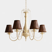 Front view of French five-light chandelier with brown fabric shades and crystal bead swags