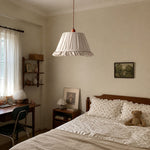Load image into Gallery viewer, Pleated fabric pendant light installed in a calm bedroom