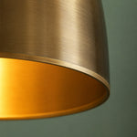 Load image into Gallery viewer, Close view of the brass shade rim and warm inner finish