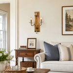 Load image into Gallery viewer, Vintage brass crystal double wall sconce installed beside a sofa