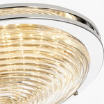 Load image into Gallery viewer, Close view of rippled glass shade and chrome rim on the ceiling light