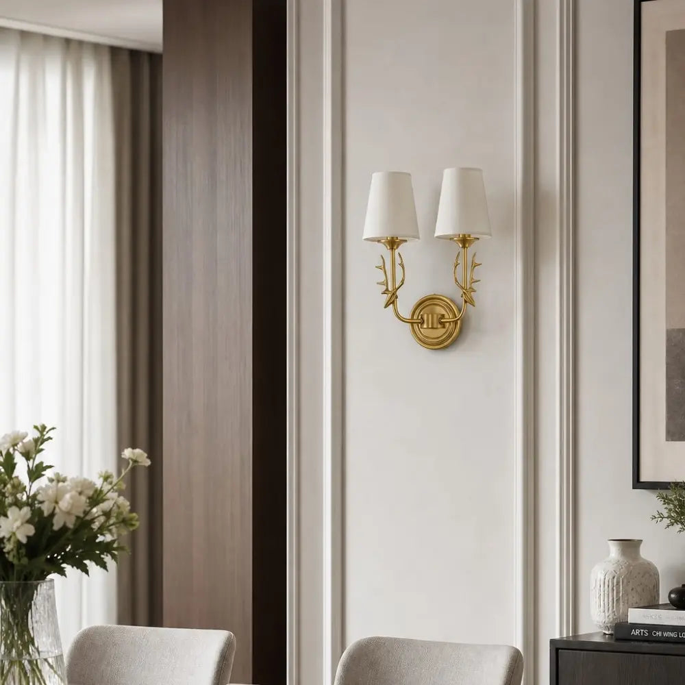 Wall-mounted antler light in a refined living space