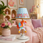 Bild in Gallery-Viewer laden, Carousel unicorn table lamp on a pink bedroom side table