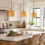 Bild in Gallery-Viewer laden, Yellow glass pendant lights over a bright kitchen counter