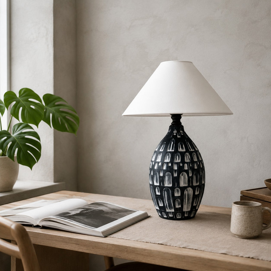 Black ceramic table lamp on a desk or console