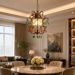 Load image into Gallery viewer, Crystal pendant light above a dining table