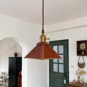 Leather pyramid pendant lamp in an arched room setting