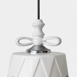 Load image into Gallery viewer, Close view of the ceramic bow and metal collar