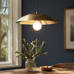 Load image into Gallery viewer, Brushed brass-finish dome pendant light in a dark dining room