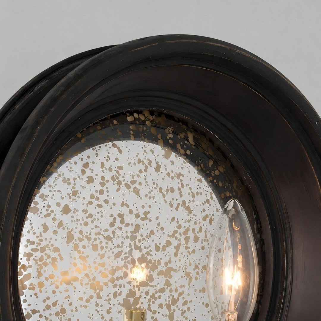 Vintage black round mirror wall sconce with brass candle arm
