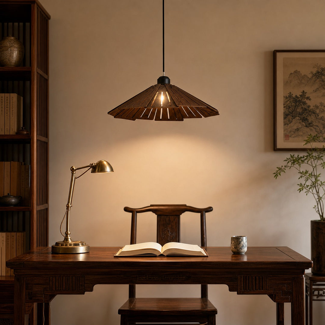 Walnut wooden pendant light above a desk