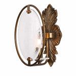 Load image into Gallery viewer, Side view of antique brass wall sconce with oval textured glass shade