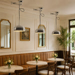 Charger l'image dans la visionneuse de galerie, Chrome pendant lights installed in a French cafe dining room