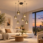 Charger l'image dans la visionneuse de galerie, Six smoked-glass shades glowing over a living room, black hardware