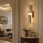 Charger l'image dans la visionneuse de galerie, Single travertine acrylic wall lamp installed beside a living room opening