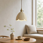Load image into Gallery viewer, Natural leather petal pendant light beside a bright table setting