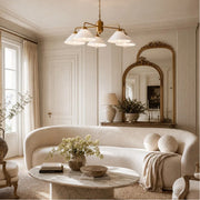 Vintage chandelier installed in an elegant light-filled living room
