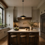 Bild in Gallery-Viewer laden, Black and brass pendant light illuminating a warm modern kitchen island
