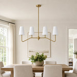 Bild in Gallery-Viewer laden, Strellux brass linear chandelier in a dining room setting