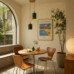 Load image into Gallery viewer, Two green jade cylinder pendant lights installed above a small dining table by an arched window