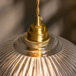 Bild in Gallery-Viewer laden, Brass cap and ribbed glass detail of the pendant light