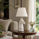 Bild in Gallery-Viewer laden, White pleated horse head table lamp in living room