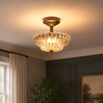 Bild in Gallery-Viewer laden, Fluted glass ceiling fixture glowing in a dark paneled room