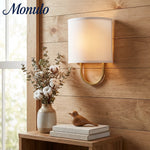 Cargar imagen en el visor de la Galería, Lámpara de pared con pantalla de tela Nolvara: aplique moderno para dormitorio con una iluminación acogedora