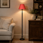 Charger l'image dans la visionneuse de galerie, Vintage black iron floor lamp beside an upholstered chair in a warm living room