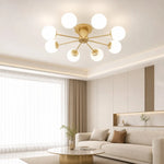 Load image into Gallery viewer, Eight-head gold globe ceiling light in a modern living room