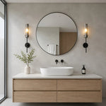 Cargar imagen en el visor de la Galería, Black copper alabaster wall sconces installed beside a round bathroom mirror