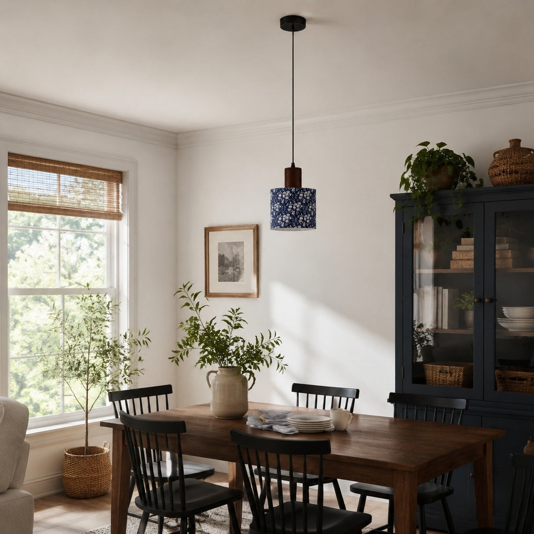 Blue floral fabric drum pendant light above a dining table