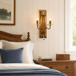 Load image into Gallery viewer, Vintage brass crystal double wall sconce installed above a bedside table