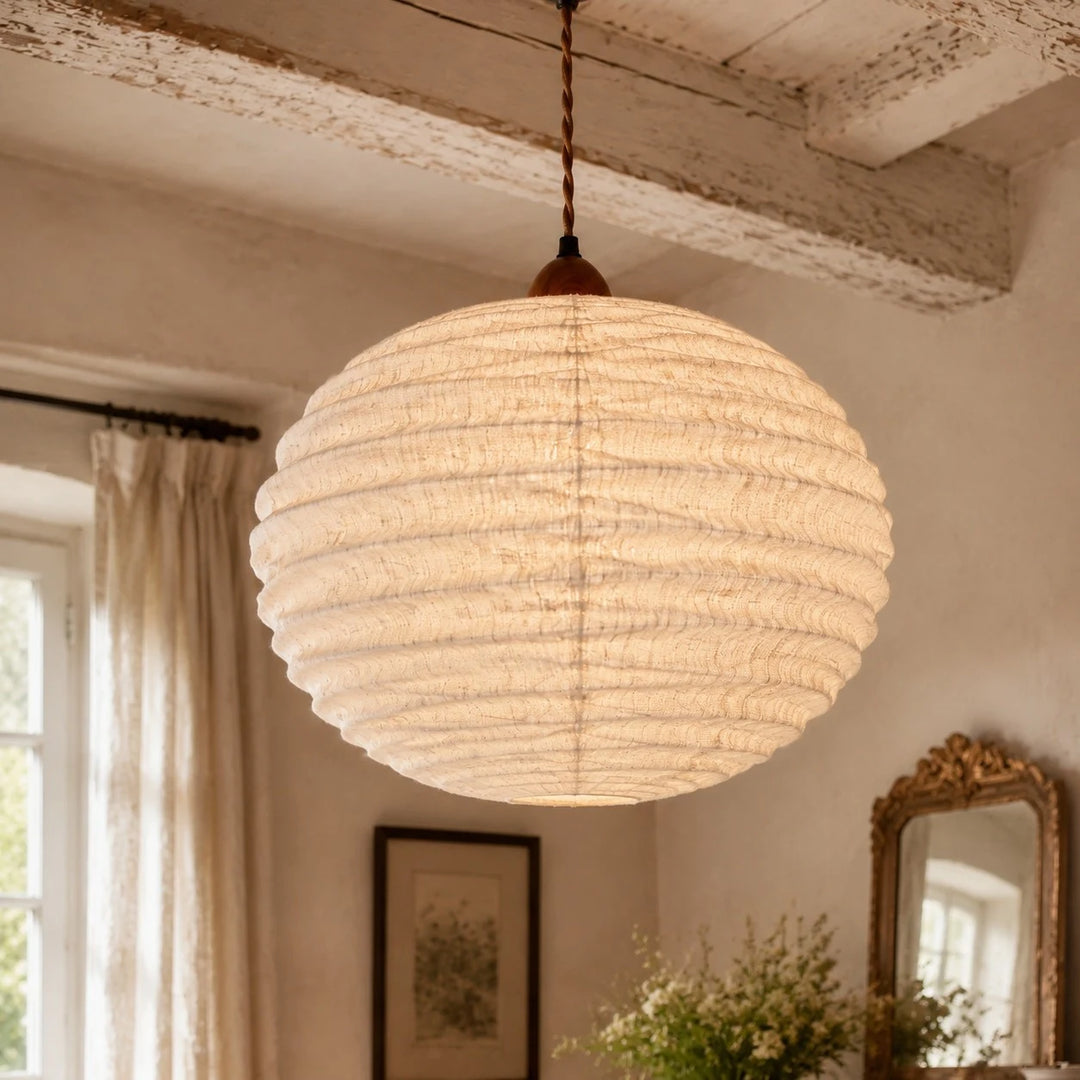 Cotton-linen round pendant light in a warm bedroom corner
