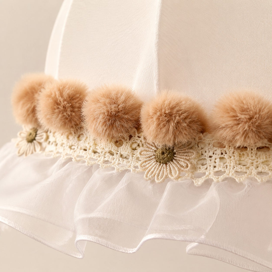 Warm camel pom-pom trim and floral lace detail