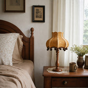 Vintage fabric table lamp styled on a bedside table