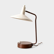 Front view of Japanese iron desk lamp with ivory shade and brown frame