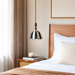 Charger l'image dans la visionneuse de galerie, Striped fabric pendant lamp installed beside a warm wood bedroom nightstand