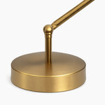 Load image into Gallery viewer, Close view of the brushed brass-tone round base and pivot joint