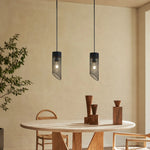 Bild in Gallery-Viewer laden, Black mesh stone pendant light installed above a round dining table
